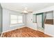 Cozy living room boasting hardwood floors, a large window, and view of the staircase and entryway at 493 Clearwater Blvd, Whiteland, IN 46184