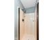 A standing shower with clean bright walls features chrome hardware and a built-in bench at 493 Clearwater Blvd, Whiteland, IN 46184