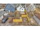 Aerial view of the fenced-in backyard with a fire pit and brick patio at 55 E Regent St, Indianapolis, IN 46225