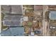 Aerial view of backyard with wooden fence, raised garden beds, and a fire pit at 55 E Regent St, Indianapolis, IN 46225