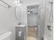 Bathroom featuring modern gray vanity, toilet and shower at 55 E Regent St, Indianapolis, IN 46225