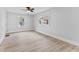 Bright bedroom featuring light wood floors, and two large windows at 55 E Regent St, Indianapolis, IN 46225