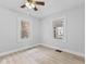 Inviting bedroom with natural light, ceiling fan, and neutral decor at 55 E Regent St, Indianapolis, IN 46225