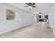 Bright living room featuring light wood floors, and large windows at 55 E Regent St, Indianapolis, IN 46225