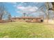 Spacious backyard with deck, shed, and wooden fence at 6149 Winnpeny Ln, Indianapolis, IN 46220