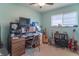 Cozy bedroom with a desk, window, and musical instruments at 6149 Winnpeny Ln, Indianapolis, IN 46220