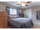 Bedroom with double bed, ceiling fan, and wooden dresser at 6149 Winnpeny Ln, Indianapolis, IN 46220