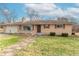 Ranch home with brick exterior, attached garage, and landscaped lawn at 6149 Winnpeny Ln, Indianapolis, IN 46220