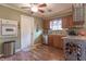 Kitchen with wood cabinets, tile backsplash, dishwasher and a built-in oven at 6149 Winnpeny Ln, Indianapolis, IN 46220