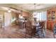 Open concept kitchen and dining area with wood cabinets and a round dining table at 6149 Winnpeny Ln, Indianapolis, IN 46220