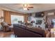 Living room with hardwood floors, fireplace, and ample natural light at 6149 Winnpeny Ln, Indianapolis, IN 46220