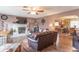 Spacious living room with hardwood floors, fireplace, and comfortable seating at 6149 Winnpeny Ln, Indianapolis, IN 46220