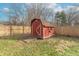 Red storage shed in the backyard at 6149 Winnpeny Ln, Indianapolis, IN 46220