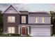 Two-story brick home with a red door and attached garage at 6153 Wainscott Trce, McCordsville, IN 46055
