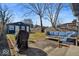 Backyard featuring a blue sofa set, grill, lawn area, wooden fence and a shed at the rear of the property at 625 Sanders St, Indianapolis, IN 46203