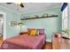 Bedroom featuring a decorative shelf and hardwood floors at 625 Sanders St, Indianapolis, IN 46203