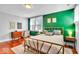 Bedroom features light green walls, and a gold bed frame at 625 Sanders St, Indianapolis, IN 46203