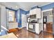 Updated kitchen with stainless steel appliances, granite countertops, and dining area at 625 Sanders St, Indianapolis, IN 46203