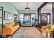 Bright living room features hardwood floors, large windows, and vintage fixtures at 625 Sanders St, Indianapolis, IN 46203
