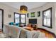 Bright living room with modern furnishings, including a sofa and armchairs at 625 Sanders St, Indianapolis, IN 46203