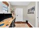 Home office features a standing desk, hardwood floors, and art at 625 Sanders St, Indianapolis, IN 46203
