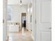Bright bathroom with tub, tiled floor, and a chandelier at 6437 N Oxbow Way, Indianapolis, IN 46220