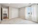 Well-lit bedroom featuring neutral walls, plush carpet, a double closet and a large window at 6437 N Oxbow Way, Indianapolis, IN 46220