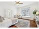Spacious bedroom with a ceiling fan, hardwood floors, and natural light at 6437 N Oxbow Way, Indianapolis, IN 46220