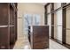 Walk-in closet with custom shelving, drawers, and a window at 6437 N Oxbow Way, Indianapolis, IN 46220