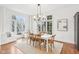 Dining room with large windows, hardwood floors, and lots of natural light at 6437 N Oxbow Way, Indianapolis, IN 46220