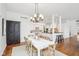 Open floor plan with dining area adjacent to kitchen and hardwood floors at 6437 N Oxbow Way, Indianapolis, IN 46220