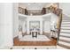 Stunning grand foyer with hardwood floors, an ornate staircase, and soaring ceilings for a dramatic entrance at 6437 N Oxbow Way, Indianapolis, IN 46220