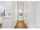 Hallway with hardwood floors and access to the kitchen at 6437 N Oxbow Way, Indianapolis, IN 46220