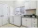 Bright laundry room with new appliances and plenty of cabinet space at 6437 N Oxbow Way, Indianapolis, IN 46220