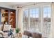 Living room with large windows providing lake views at 6437 N Oxbow Way, Indianapolis, IN 46220