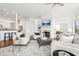 Bright living room with fireplace, large rug, hardwood floors, and an open concept at 6437 N Oxbow Way, Indianapolis, IN 46220