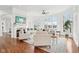 Bright living room with a fireplace, large windows, hardwood floors, and an open concept at 6437 N Oxbow Way, Indianapolis, IN 46220