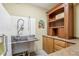 Utility room with stainless steel sink and convenient storage solutions at 6437 N Oxbow Way, Indianapolis, IN 46220