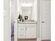Modern bathroom featuring a white vanity with grey countertop and a framed mirror at 6777 Pulaski Ct, Carmel, IN 46033