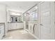 Well-lit bathroom with a double vanity, glass-enclosed shower, and modern finishes at 6777 Pulaski Ct, Carmel, IN 46033