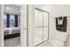 Clean bathroom featuring a white shower, a toilet, and an open doorway to the bedroom at 6777 Pulaski Ct, Carmel, IN 46033