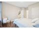 Inviting bedroom featuring a soft chair, hardwood floors, and a bright, airy atmosphere at 6777 Pulaski Ct, Carmel, IN 46033