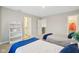 Bedroom with twin beds, featuring a view to the ensuite bathroom at 6777 Pulaski Ct, Carmel, IN 46033