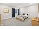 Bedroom showcasing plush carpeting, soothing paint colors, and a queen-size bed, ideal for rest and relaxation at 6777 Pulaski Ct, Carmel, IN 46033