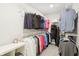 Well-organized walk-in closet with ample shelving and hanging space for clothes and accessories at 6777 Pulaski Ct, Carmel, IN 46033
