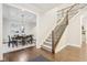 Open-concept entryway with view to dining room and staircase at 6777 Pulaski Ct, Carmel, IN 46033
