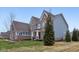 Stunning exterior elevation features a brick and siding combination, showcasing the home's architectural details at 6777 Pulaski Ct, Carmel, IN 46033