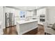 Modern kitchen featuring white cabinetry, stainless steel appliances, and a kitchen island with a sink at 6777 Pulaski Ct, Carmel, IN 46033