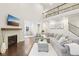 Spacious living room with a fireplace, an upstairs balcony and dark hardwood floors at 6777 Pulaski Ct, Carmel, IN 46033