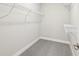 A walk-in closet with metal shelving, offering storage for shoes, clothes, and accessories at 6777 Pulaski Ct, Carmel, IN 46033
